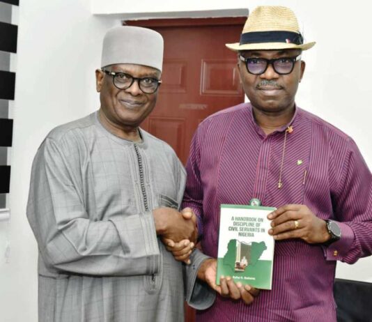 l-r: Director-General, BPP, Mamman Ahmadu, FNIQS, being presented with a book titled "Discipline of Civil Servants in Nigeria" by the Author, Hon. Commissioner, Rivers, Bayelsa & Delta States Hon. Rufus N. Godwins during his visit to the Bureau