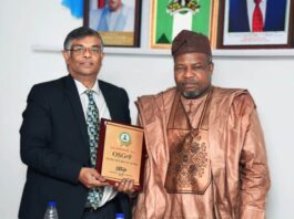 FROM RIGHT: SGOF, Surv. Abuduganiyu Adebomehin mnis, fce, presenting sourvenir to the Indian High Commissioner to Nigeria Ambassador Shri G. Balasubramanian during an interactive session with the Indian delegation who visited the SGOF in his Office in Abuja