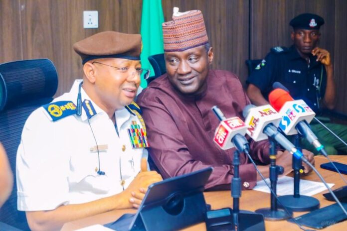 Lassa Fever3 Permanent Secretary, Federal Ministry of Environment, Mahmud Adam Kambari (right) representing the Minister of State for Environment and the Registrar, EHCON, Dr. Yakubu Baba- Muhammad (left) in a tete a tete during the briefing in Abuja