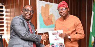 Hon. Minister of State for Environment, Dr Iziaq Adekunle Adeboye Salako right, receiving some journals from the President of Nigerian Mining and Geosciences Society, Prof. Akinade Olatunji during the courtesy visit to the Minister in Abuja.