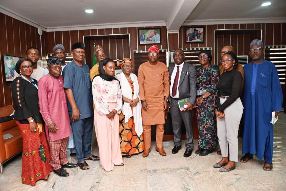 Hon. Minister of State for Environment, Dr Iziaq Adekunle Adeboye Salako in a group Photograph with the delegation of the Society and some staff of the Ministry in Abuja.