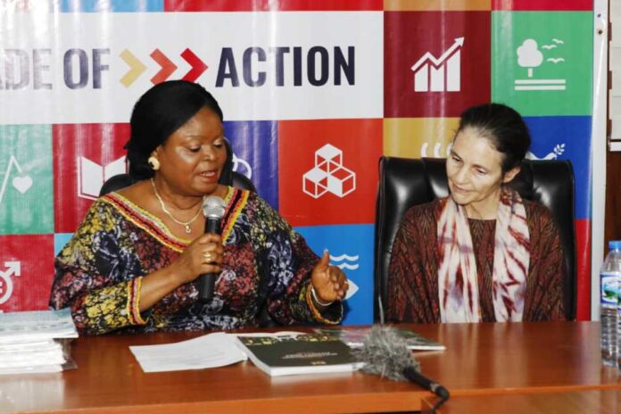 On the left is the Senior Special Assistant to the president on SDGs, Princess Adejoke Orelope-Adefulire, explaining some implementation solution plans documents to the Global Director, Oxford Poverty and Human Development Initiative, Professor Sabina Alkire.
