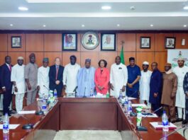 Minister of Budget and Economic Planning Senator Abubakar Atiku Bagudu (c) flanked by John Olajide, Chairman corporate Council on Africa and CEO Axxess Technology Solution (L), Florie Liser President and CEO, Corporate Council of Africa and other dignitaries during a courtesy visit to the Minister today, in Abuja.