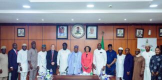 Minister of Budget and Economic Planning Senator Abubakar Atiku Bagudu (c) flanked by John Olajide, Chairman corporate Council on Africa and CEO Axxess Technology Solution (L), Florie Liser President and CEO, Corporate Council of Africa and other dignitaries during a courtesy visit to the Minister today, in Abuja.