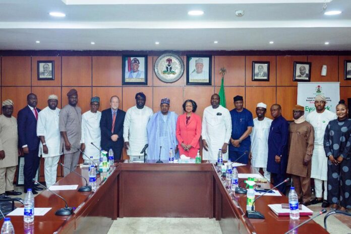 courtesy visit Minister of Budget and Economic Planning Senator Abubakar Atiku Bagudu (c) flanked by John Olajide, Chairman corporate Council on Africa and CEO Axxess Technology Solution (L), Florie Liser President and CEO, Corporate Council of Africa and other dignitaries during a courtesy visit to the Minister today, in Abuja.
