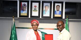 The Honourable Minister of Youth Development, Dr. Jamila Bio-Ibrahim receiving a plague from the DG, IPCR, Dr. Joseph Ologwu during a courtesy visit of the delegates from IPCR to the Ministry of Youth Development in Abuja.