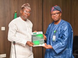 The Hon. Minister of State for Environment, Dr. Iziaq Adekunle Adeboye Salako (left), receiving the Nigeria Data Protection Annual Report from CEO, NDPC, Dr. Vincent Adetola during the Commission's courtesy visit to the Ministry in Abuja