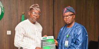 The Hon. Minister of State for Environment, Dr. Iziaq Adekunle Adeboye Salako (left), receiving the Nigeria Data Protection Annual Report from CEO, NDPC, Dr. Vincent Adetola during the Commission's courtesy visit to the Ministry in Abuja