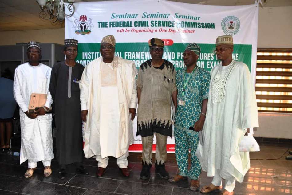 Hon. Chairman, Federal Civil Service Commission (FCSC) Prof. Tunji Olaopa (8th Right) flanked (L & R) by Hon. Commissioners, Speaker/Panelists and Acting Perm. Sec.