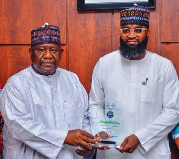 L-R. DG BPSR, Mr. D.I Arabi presenting a plaque to EVC/CEO NASENI Mr. Khalil Sulayman Halilu.