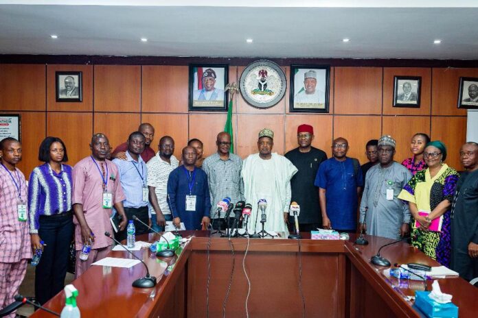Budget Padding The honourable Minister of Budget and Economic Planning, Sen. Abubakar Atiku Bagudu flanked to the right by the Permanent Secretary of the Ministry, Engr. Nebeolisa Anako and members of the press