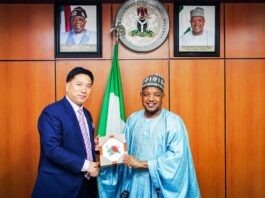 Mr. Li-Zheusheng leader of the CAETPC delegation presenting a souvenir to the Hon. Minister of Budget and Economic Planning Sen. Abubakar Atiku Bagudu yesterday.