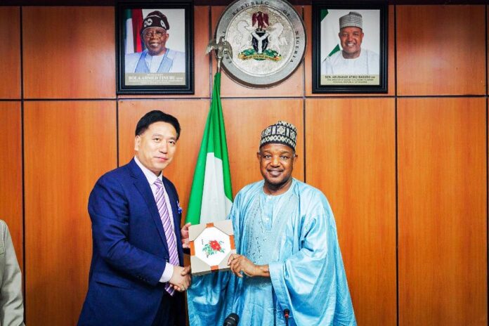 Mr. Li-Zheusheng leader of the CAETPC delegation presenting a souvenir to the Hon. Minister of Budget and Economic Planning Sen. Abubakar Atiku Bagudu yesterday.