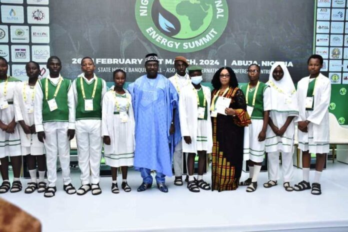 Certificate of Participation at 2024 NIES Secretary to the Government of the Federation, H.E. George Akume (6th left) in a photograph with representatives of Government Secondary School, Tudun Wada, Abuja after the presentation of Certificate of Participation at 2024 NIES during the closing ceremony of 7th edition of Nigeria International Energy Summit in Abuja.