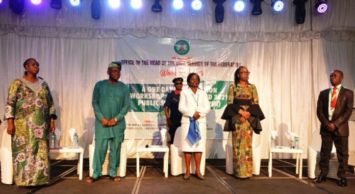 HRM Directors on Revised 2021 PSR1 The Permanent Secretary, SPSO, Dr. Deborah Bako Odoh (centre) flanked by Director ODD, Dr. Mimi Abu, Director HRM,OHCSF, Mr. Raymond Uwaneyi (right) and facilitators, Mrs. Bola Thomas and Oni Fatunwashe (left) at a one day Workshop on Revised 2021 PSR organised for Directors of HRMs from core MDAs on 20th March, 2024 in Abuja.