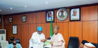 Rt. Hon. Isiaka Ibrahim Ayokunle presenting the workplan/ proposal on an effective budget process to the Hon. Minister of Budget and Economic Planning, in his office yesterday.