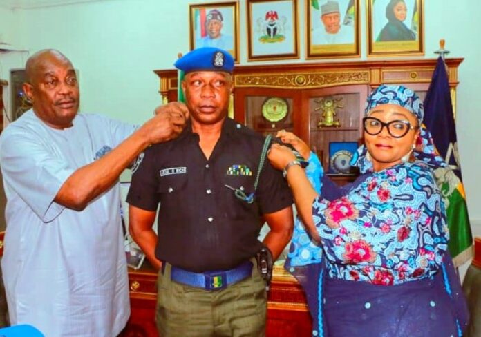 MPA Management presents Bus to Union4 L-R: Chairman of Police Service Commission, Dr. Solomon Arase and Minister of State, Hajia Imaan Sulaiman-Ibrahim, decorating newly promoted Chief Security Officer (CSO) Minister of Police Affairs SP Abdul Gafar Bichi at the Headquarters of the Ministry in Abuja