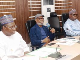 Inauguration of The Ministerial Committee For The Development of Nigeria's Bitumen Resources And The Technical Committee To Monitor The Bitumen Resource Development Activities: The Honorable Minister of Solid Minerals Development Dr Dele Alake addressing Committee Members: Left is Director Human Resource Mgt Dept, Alhaji Suleman Mohammed Kabir mni ( representing the Permanent Secretary) Right: Engr Obadiah Nkom Director General Nigeria Mining Cadastre Office; held @ the Ministry's Headquarters Office Abuja on March 28 2024