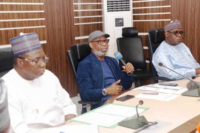Inauguration of The Ministerial Committee For The Development of Nigeria's Bitumen Resources And The Technical Committee To Monitor The Bitumen Resource Development Activities: The Honorable Minister of Solid Minerals Development Dr Dele Alake addressing Committee Members: Left is Director Human Resource Mgt Dept, Alhaji Suleman Mohammed Kabir mni ( representing the Permanent Secretary) Right: Engr Obadiah Nkom Director General Nigeria Mining Cadastre Office; held @ the Ministry's Headquarters Office Abuja on March 28 2024