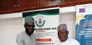 L-R: Hon. Omang exchanging pleasantries with the DG BPSR, Mr. Dasuki Arabi during the visit.