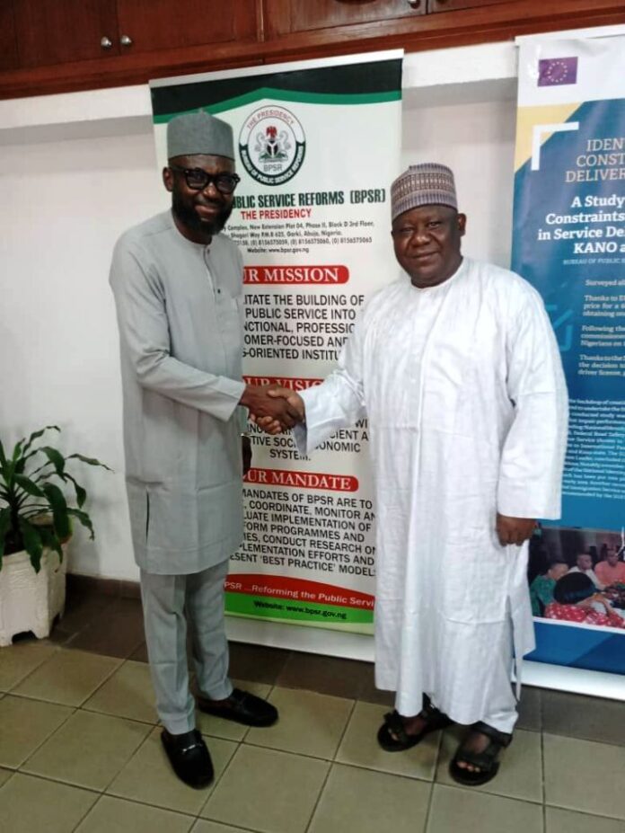 L-R: Hon. Omang exchanging pleasantries with the DG BPSR, Mr. Dasuki Arabi during the visit.