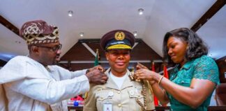 Minister of Interior, Hon. Dr. Olubunmi Tunji-Ojo, decorating the newly appointed Comptroller General of Immigration Service (CGIS), Kemi Nanna Nandap