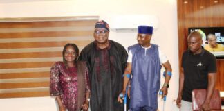 Hon. Chairman, Federal Civil Service Commission (FCSC), Prof. Tunji Olaopa (Middle in Black) with the President, PLWD group, Mr. Joshua Dauda Bungon (Immediate Right) and other members of the association during their courtesy visit to the Chairman.