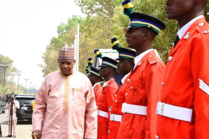 Minister of Police Affairs, Senator Ibrahim Gaidam inspecting Quarter Guard mounted by the cadets of the Police Academy during an official visit to the Police College Wudil, Kano State.