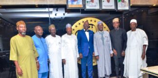Minister and Minister of State, Housing and Urban Development , Arch Ahmed Dangiwa and Abdullahi Tijjani Gwarzo in a group photograph with the leadership of Real Estate Developers Association of Nigeria (REDAN) during their visit to his office.