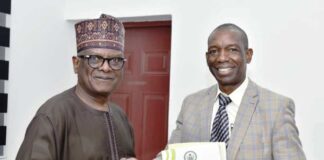 L-R: Director-General, BPP, Mamman Ahmadu, FNIQS, presenting Bureau's document to Mr. Patrick Owuori during the later visit to the Bureau