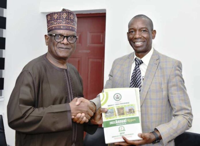 L-R: Director-General, BPP, Mamman Ahmadu, FNIQS, presenting Bureau's document to Mr. Patrick Owuori during the later visit to the Bureau