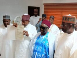 Permanent Secretary, Dr. Nasir Sani Gwarzo, Honourable Minister of Police Affairs, Senator Ibrahim Gaidam , Emir of Fika and Chairman of Yobe State Council of Traditional Rulers, Alhaji Dr. Muhammadu Abali Ibn Muhammadu during the presentation of a certificate of Wakama of Fika Emirate at the Headquarters of the Ministry of Police Affairs, Abuja.