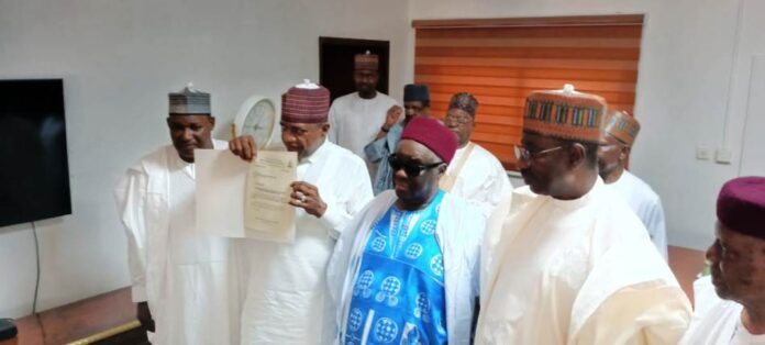 Senator Ibrahim Gaidam Elevated to Makama of Fika Emirate Permanent Secretary, Dr. Nasir Sani Gwarzo, Honourable Minister of Police Affairs, Senator Ibrahim Gaidam , Emir of Fika and Chairman of Yobe State Council of Traditional Rulers, Alhaji Dr. Muhammadu Abali Ibn Muhammadu during the presentation of a certificate of Wakama of Fika Emirate at the Headquarters of the Ministry of Police Affairs, Abuja.