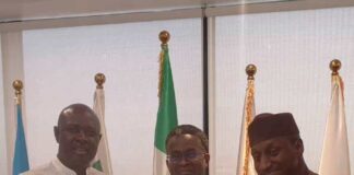 Honourable Minister of State Petroleum Resources (Oil) Sen. Heineken Lokpobiri Ph.d (left) receiving the document on the activities of SPE Nigeria Council from the Council's Board of Trustee (BOT) Chairman, Emeka Ene (c) and 2024 SPE NC Chairman, Salahuddeen M. Tahir (right) during the visit to the Minister in Abuja.