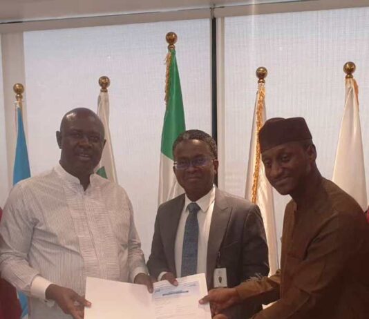 Honourable Minister of State Petroleum Resources (Oil) Sen. Heineken Lokpobiri Ph.d (left) receiving the document on the activities of SPE Nigeria Council from the Council's Board of Trustee (BOT) Chairman, Emeka Ene (c) and 2024 SPE NC Chairman, Salahuddeen M. Tahir (right) during the visit to the Minister in Abuja.