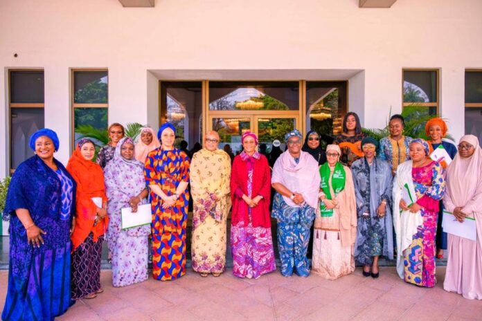 First Lady of the Federal Republic of Nigeria, Senator Oluremi Tinubu( middle) flanked to the left by the wife of the Vice President of the Federal Republic of Nigeria Hajia Nana Shettima and to the right by the Wife of the Senate President Mrs Unnoma Ekaette Akpabio and other wives of state governors after the quarterly meeting of Zonal and State Coordinators of the Renewed Hope Initiative RHI at the State House Abuja on Wednesday 27th March