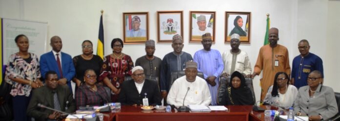 Seated |L-R: DCP Aremu Bamidele; Director Finance & Account (NPTF), Omotosho Olubunmi; Director Legal (NPTF), Mallam A. A. Adamu; Permanent Secretary, Dr. Nasir Sani Gwazo; Director Legal (MPA), Fati Lamorde; Director Police Inspectorate (MPA), Bola Aderele; Director Planning, Research and Statistics, Azeez Margaret; Deputy Director Legal (FMOJ), Sangaril Victoria Mariam, and others members during the inauguration of the 24-man committee on review of the Nigeria Police Trust Fund (NPTF) Act 2019 at the Ministry Headquarters in Abuja.