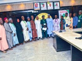 Hon Minister and Minister of State,,Housing and Urban Development, Arc Ahmed Musa Dangiwa and Abdullahi Tijjani Gwarzo in a group photograph with members of the National Association of Directors and Heads of Local Govt Departments of Works, Housing, Transport and Environment during their visit