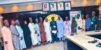Hon Minister and Minister of State,,Housing and Urban Development, Arc Ahmed Musa Dangiwa and Abdullahi Tijjani Gwarzo in a group photograph with members of the National Association of Directors and Heads of Local Govt Departments of Works, Housing, Transport and Environment during their visit