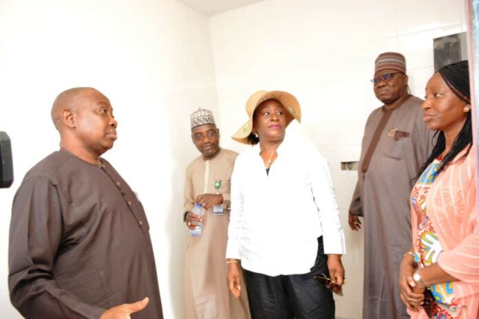 L-R: ES,FGSHLB, Mr. Ibrahim Mairiga with HoSF, Dr. Folasade Yemi-Esan at the site inspection