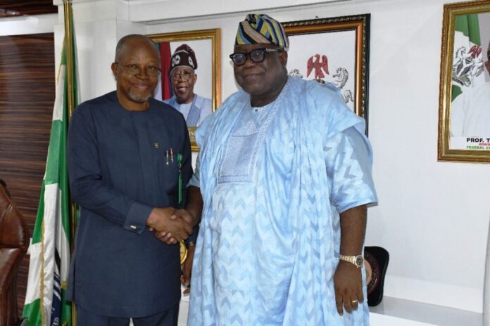 Hon. Chairman FCSC, Prof. Tunji Olaopa (R) with the FCT-CSC Chairman, Engr. Emeka Ezeh.