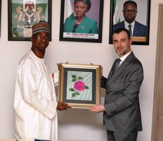 Mr. Yunus Sonmez, Director General of the Cabinet , ICYF Presenting a gift to Dr. Dunama Umar Ahmed, Permanent Secretsry Federal Ministry of Youth Development, during his courtesy visit on the Permanent Secretary.