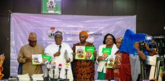 L-R, Dr Tunji Alausa,HMSH, Prof Muhammad Ali Pate,CMH&SW,Daju Kachollom mni, PSH,Dr.Binyerem Ukaire,DIRECTOR Family Health and Mrs.Ladidi Bako-Aiyegbusi Director Nutrition display the 2 documents on Labour Guide and Guidelines for Community Use of Misoprostol.