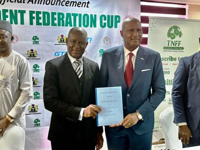 The minister of sports Senator John owan Enoh and CEO of GTI Mr Abubakar lawal after the signing of the mou