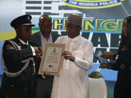 CSP Odeyemi Oladimeji, O/C Antikidnapping Unit, Imo State Command receiving his award of Crime Buster of the Year from Minister of Police Affairs, Senator Ibrahim Gaidam during the maiden edition of the award ceremony of the Nigeria Police Awards and Commendations held at the Congress Hall, Transcorp Hilton, Abuja.