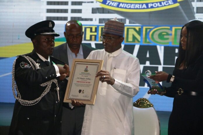 National Police Day2 CSP Odeyemi Oladimeji, O/C Antikidnapping Unit, Imo State Command receiving his award of Crime Buster of the Year from Minister of Police Affairs, Senator Ibrahim Gaidam during the maiden edition of the award ceremony of the Nigeria Police Awards and Commendations held at the Congress Hall, Transcorp Hilton, Abuja.