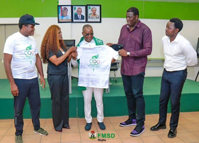 Nigeria Olympians Association Courtesy Visit to the Minister of Sports1 L- R The Secretary of the Nigeria Olympians Association, Emmanuel Babayero, Olympian medalist, Christy Opara, the Honourable Minister of Sports Development, Senator John Owan-Enoh, the President, Nigeria Olympians Association, Olamide Oyedeji and another member, Oluwafemi Ajiloye during the decoration of the Minister by the President of the Association.