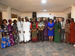 Representative of the Head of Service, Dr Comfort Adeosun (6th L) in a group photograph with members of the Safety, Health and Hazard Control Committee, after the inauguration in Abuja.