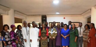 Representative of the Head of Service, Dr Comfort Adeosun (6th L) in a group photograph with members of the Safety, Health and Hazard Control Committee, after the inauguration in Abuja.