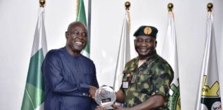 Minister of State Petroleum Resources (Oil), Sen. Heineken Lokpobiri, receiving a Plaque from Chief of Defence Staff, Gen. Christopher Musa during the courtesy visit.